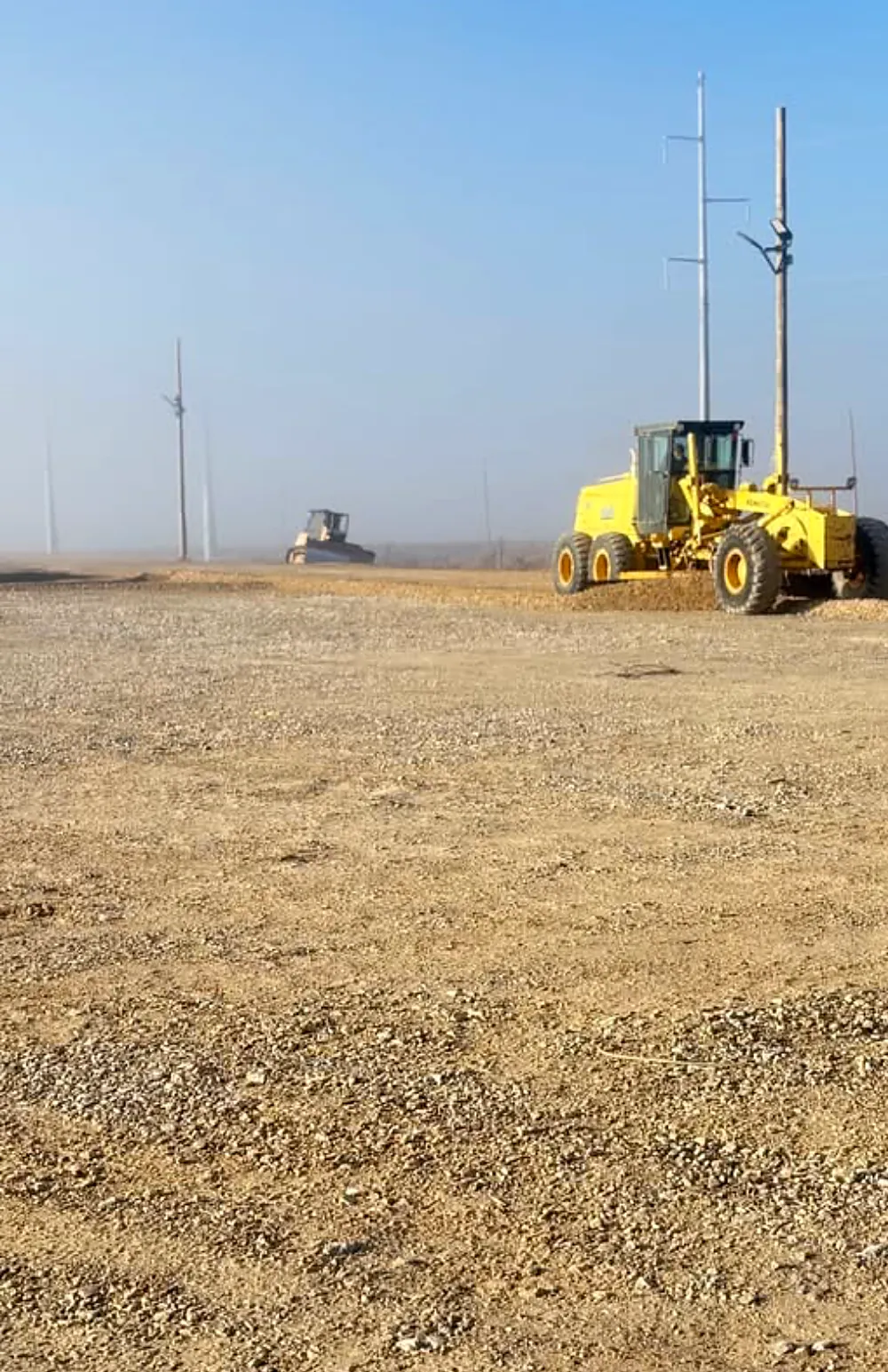 Motor grader working a job site