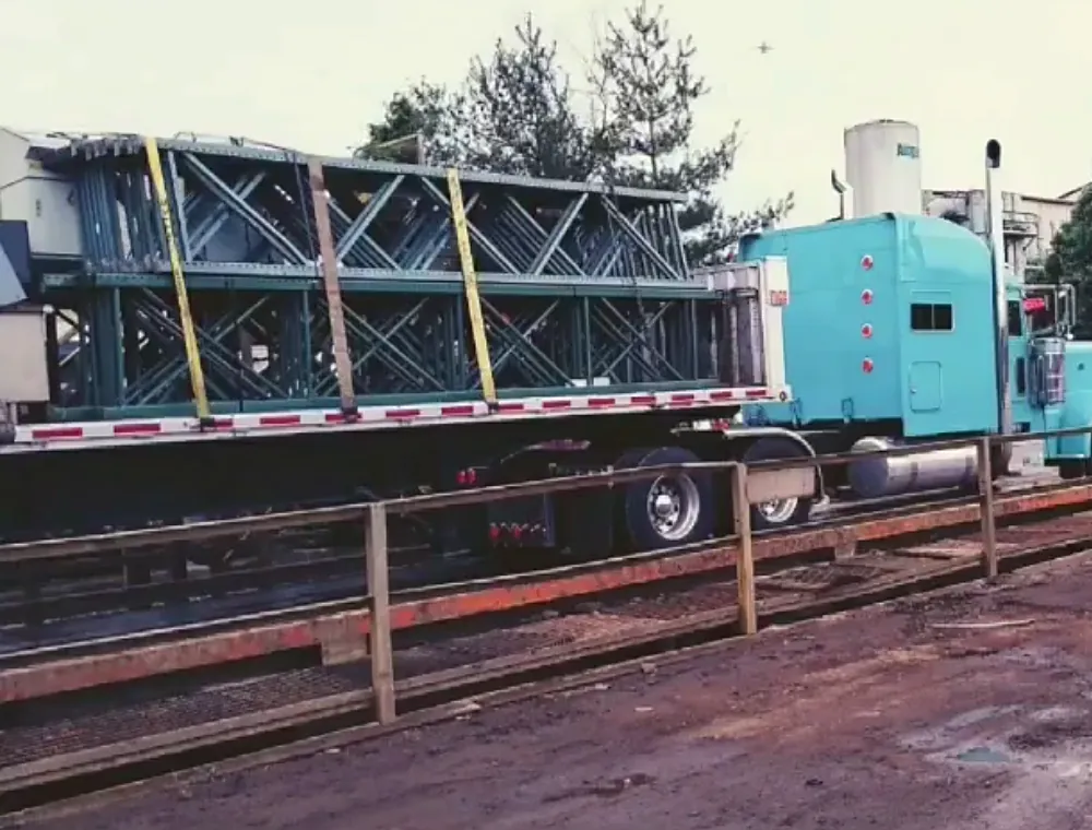 Lowboy trailer carrying a large tank