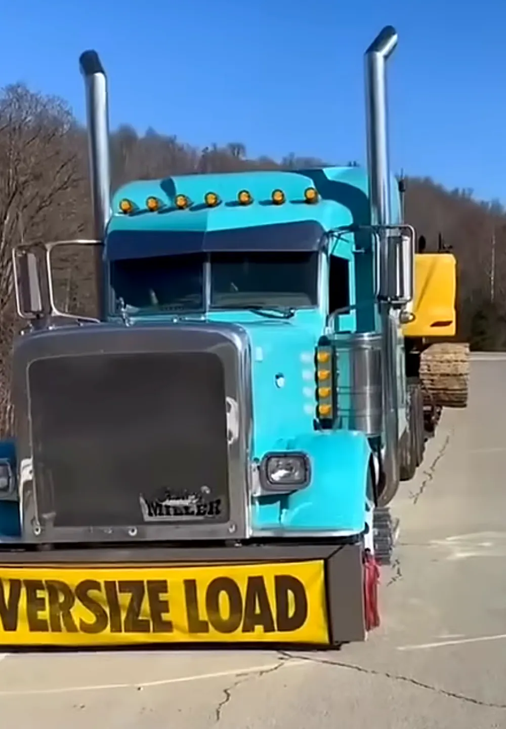 Truck with an oversize load banner