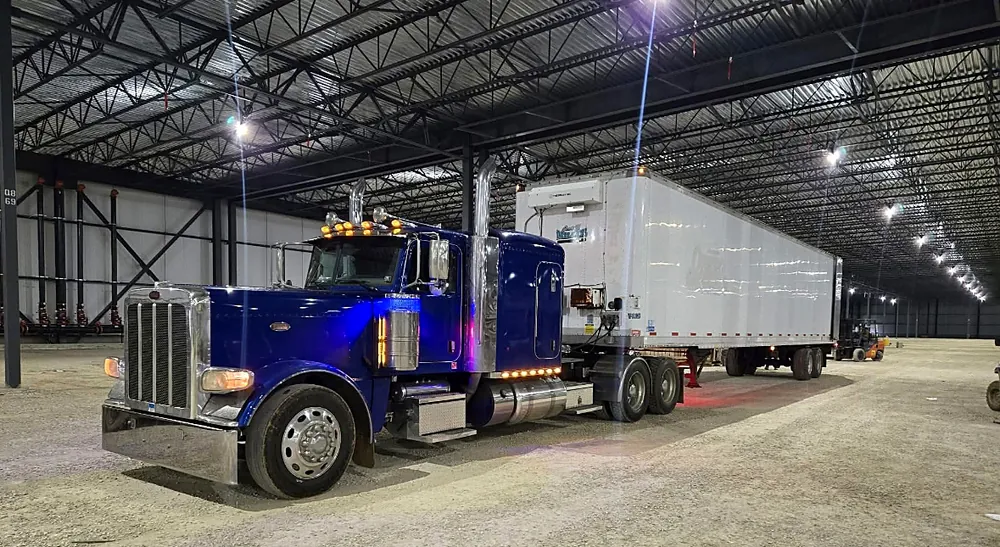 Travis G. Miller truck and trailer inside a warehouse